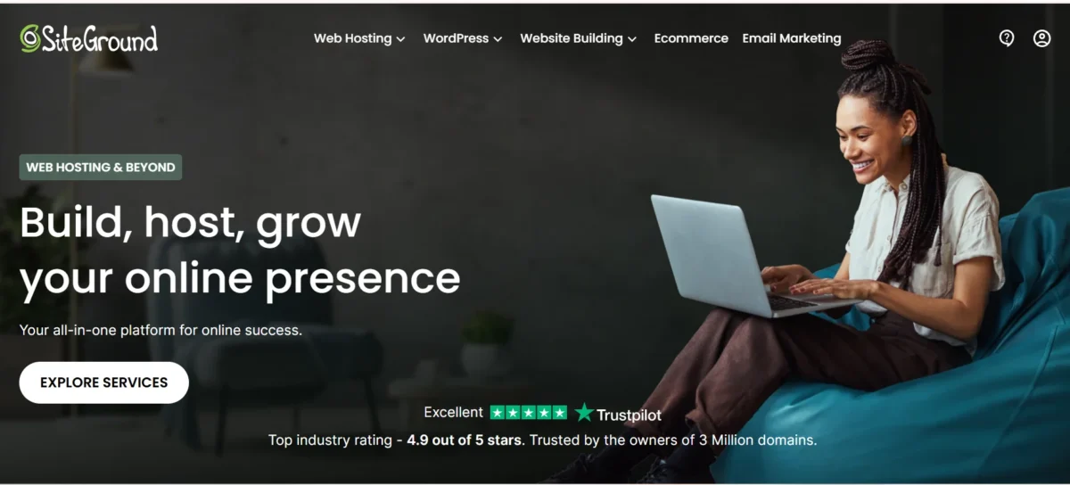 SiteGround web hosting homepage showing a woman using a laptop with the headline build host grow your online presence